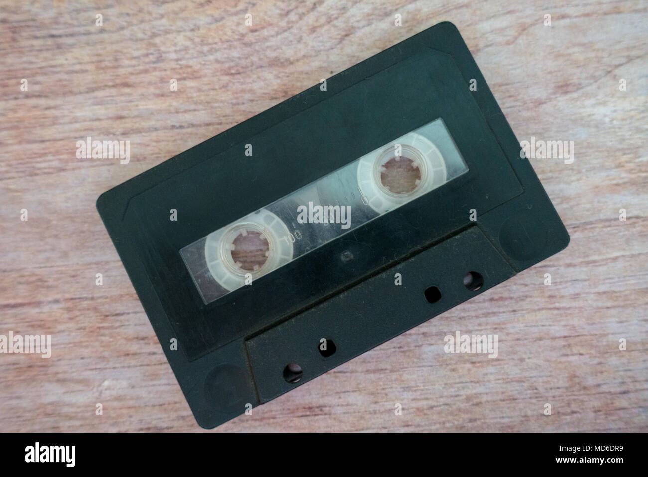 Old cassette tapes with a wooden brown background Stock Photo - Alamy