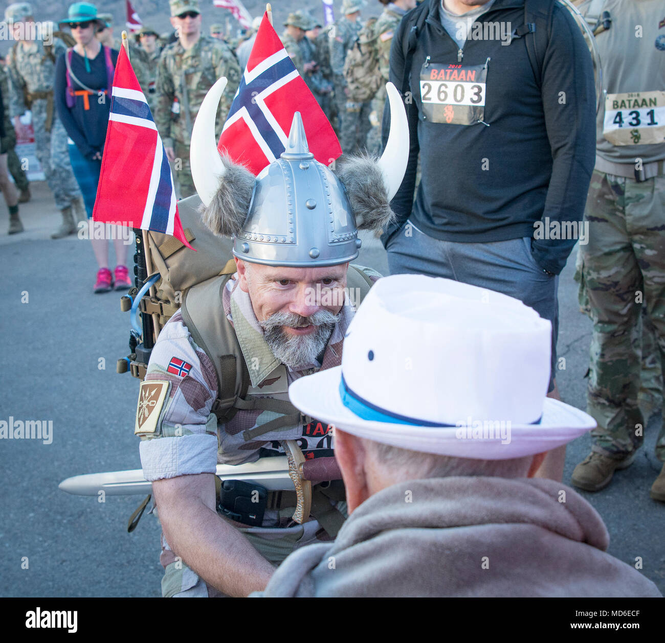 Jorg Lian, a Norwegian Army officer who recieved the War Cross with Swords, Norway’s highest award for bravery in combat, on May 8, 2011 “to have demonstrated particularly outstanding bravery and leadership during international operations in Afghanistan in 2009” greets 100-year-old Bataan Death March survivor Col. Ben Skardon, a beloved Clemson University alumnus and professor emeritus, before the Bataan Memorial Death March at White Sands Missile Range, N.M., March 25, 2018. (Photo by Ken Scar) Stock Photo