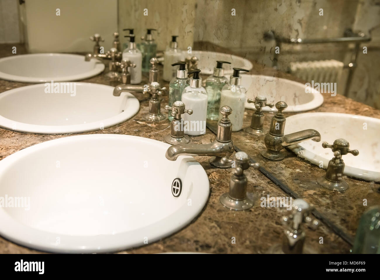 Sinks in the Public Restroom, Retro Style Mirrow and Taps Stock Photo