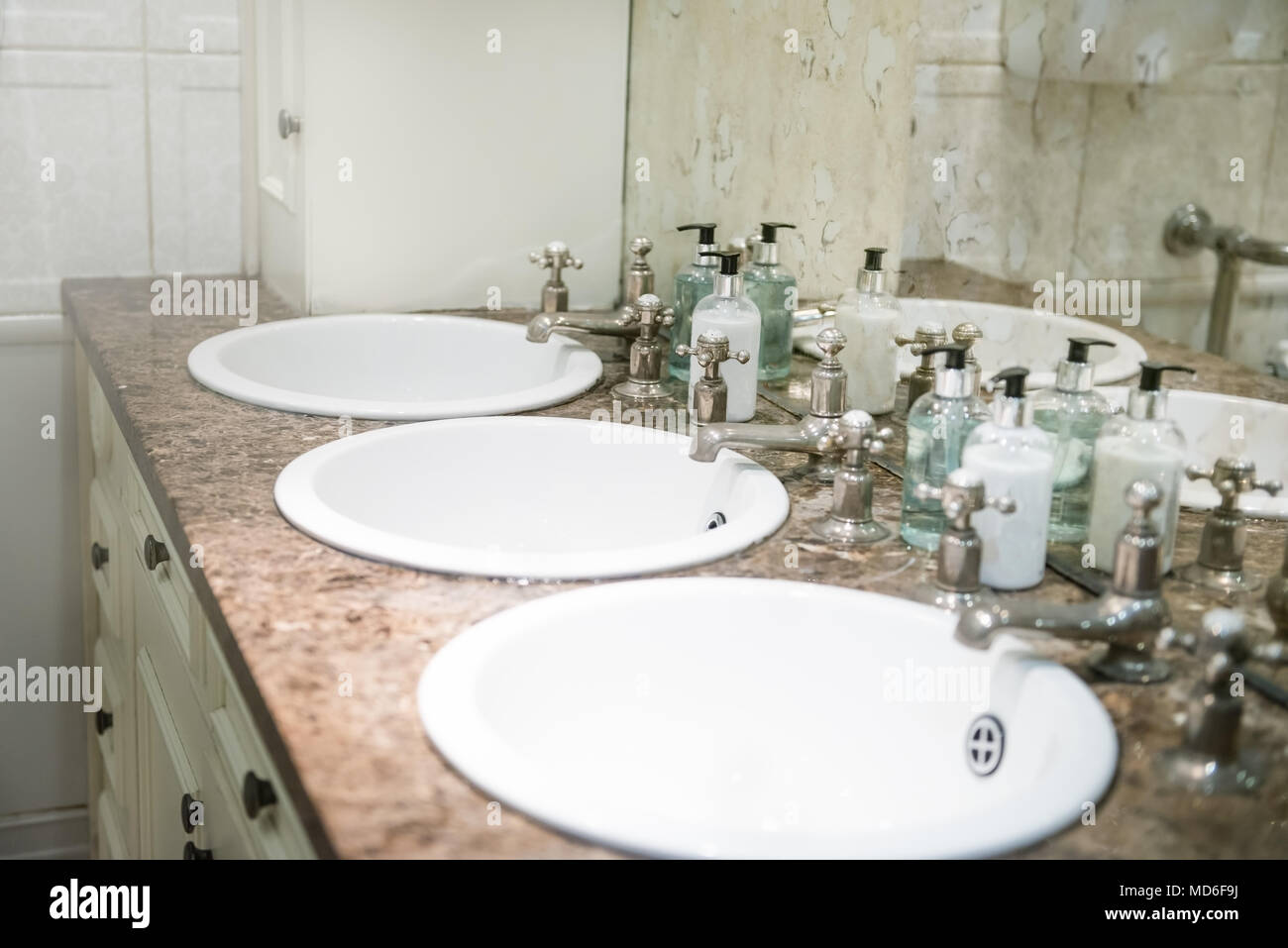 Sinks in the Public Restroom, Retro Style Mirrow and Taps Stock Photo