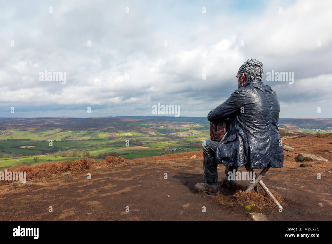 The Seated Man Sculpture by artist Sean Henry on Castleton Rigg a high point in the North Yorkshire Moors National Park overlooking Westerdale Stock Photo