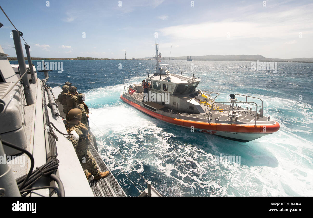 A 47-foot Motor Lifeboat, assigned to U.S. Coast Guard Sector Guam, pulls  alongside a Mark VI patrol boat, assigned to Coastal Riverine Group (CRG)  1, Det. Guam, during a towing exercise in