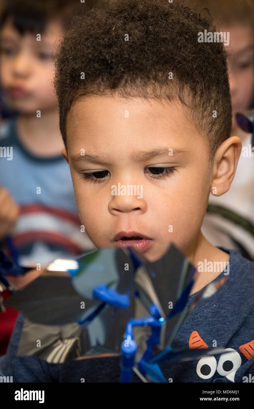 Preston Shepard, 3, plays with a pinwheel during the Pinwheels for