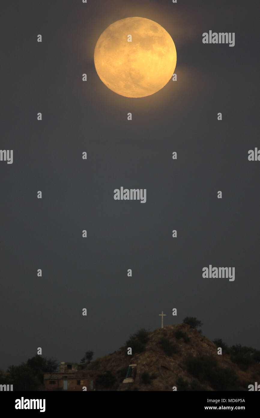 The full moon in the month of October is the most anticipated of the year, is the only natural satellite of the Earth and was seen leaving this afternoon on the hill of the colony Ranchito east of the capital of Sonora Mexico.  HermosilloSonora  a 26 oct 2015. ****  The Moon is the only natural satellite of Earth. With an equatorial diameter km1 3474 is the solar system's largest satellite fifth, while as compared to the proportional size of its planet is the largest satellite: one quarter the diameter of Earth and 1/81 its mass.  Una de las primeras lunas llenas del año 2013 se pudo apreciar  Stock Photo