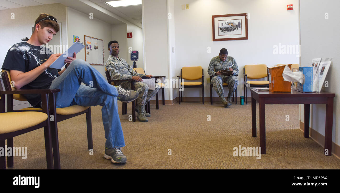 Patients fill out paperwork in the public health waiting room at Dyess Air  Force Base, Texas, March 22, 2018. The public health flight sees  approximately 25 to 30 patients every day for