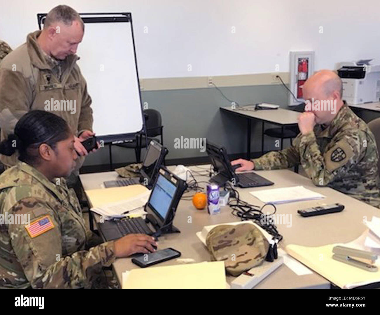 Col. Steven Sanson and Capt. Angel Jones upload observations into the Joint Lessons Learned Information System at Regional Medic 2018.  Army Reserve Medical Command’s Medical Readiness and Training Command delivers relevant and realistic collective training for Joint, Multi-National, and Reserve Component Forces through the Army Reserve’s Combat Support Training Program.  Approximately 150 personnel assigned to MRTC and Western Medical Area Readiness Support Group served as Observer Coach / Trainers (OC/Ts) and support staff to run Regional Medic for a training audience of approximately 2,100  Stock Photo