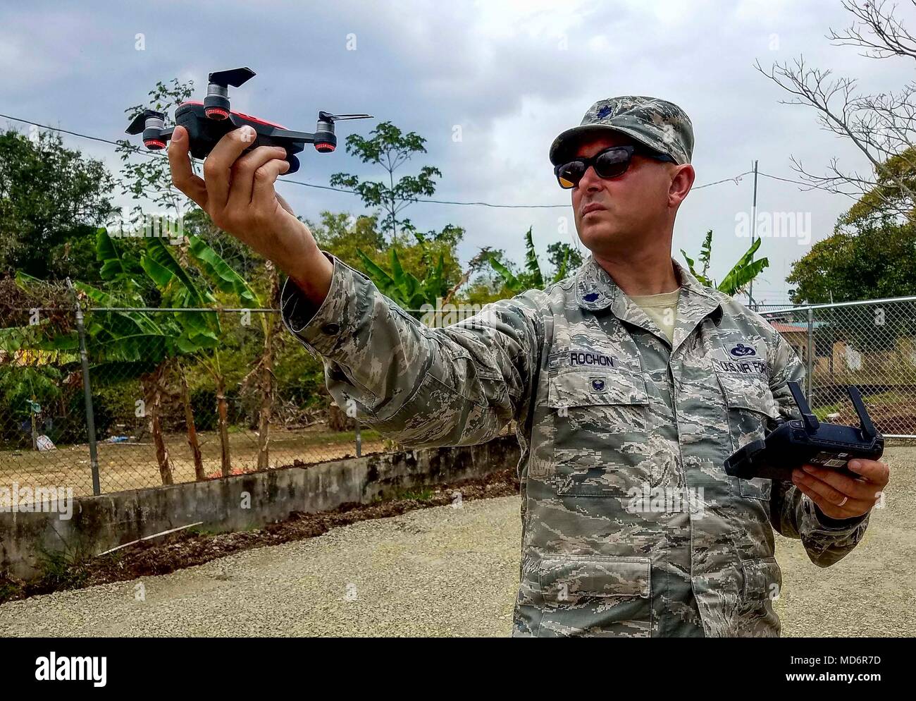 U.S. Air Force Lt. Col. Matthew Rochon, 346th Air Expeditionary Group deputy commander, prepares to operate a small drone to photograph work sites in Meteti, Panama, March 30, 2018. As construction projects continue, photographs will help document the work being done. Exercise New Horizons is a joint training exercise where all branches of the U.S. military conduct training in civil engineer, medical and support services while benefiting the local community. (U.S. Air Force photo by Senior Airman Dustin Mullen/Released) Stock Photo