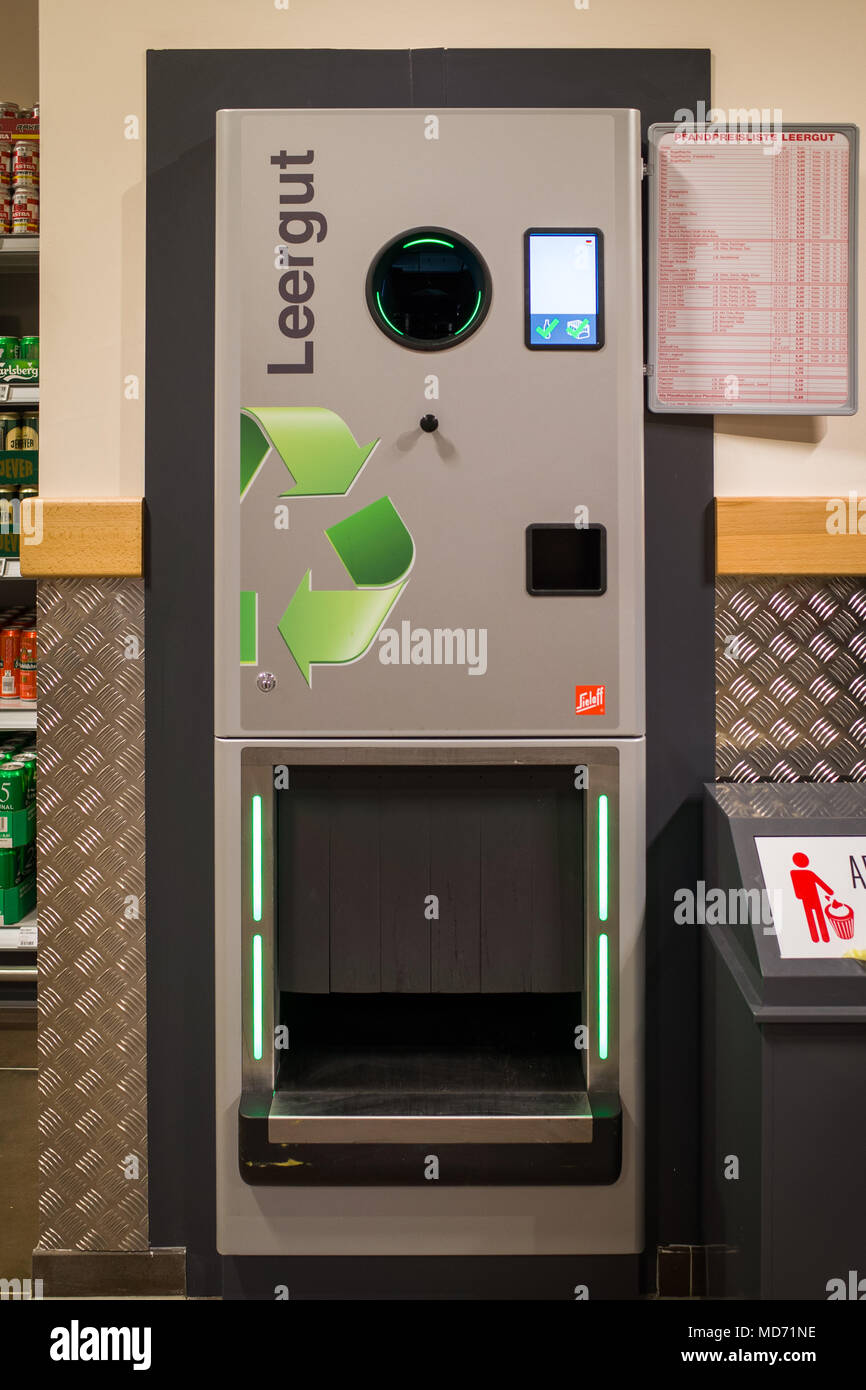 Recycling bottles at a German supermarket. Customer receives money off