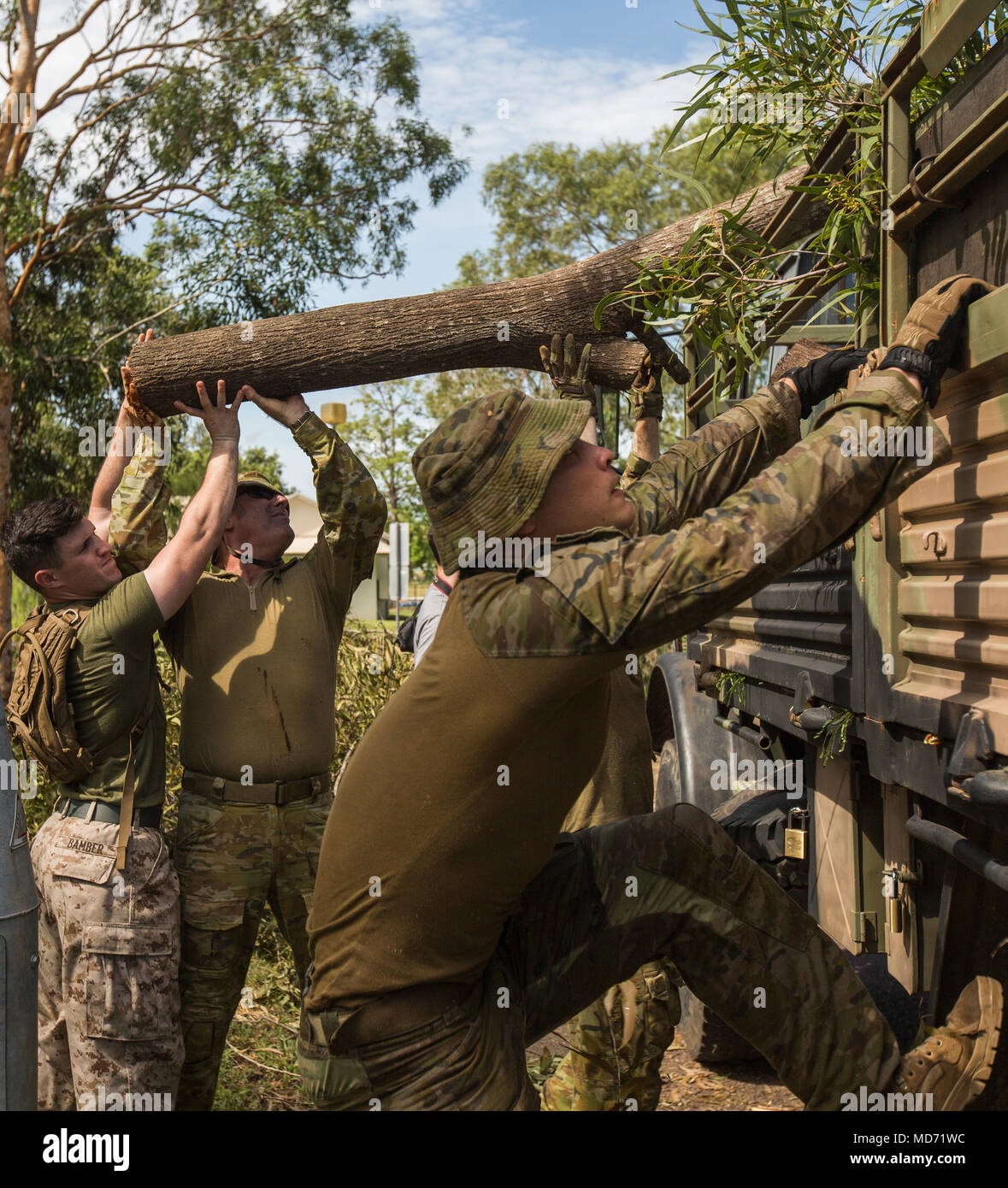 U.S. Marines and Australian Defence Force service members assist in ...