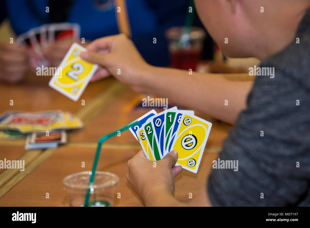 Camp Foster Okinawa Japan A Participant Draws A Card While Playing Uno During English Fun And Games March 23 At Aeon Mall In Okinawa Japan Marines Would Nonverbally And Verbally Communicate Using