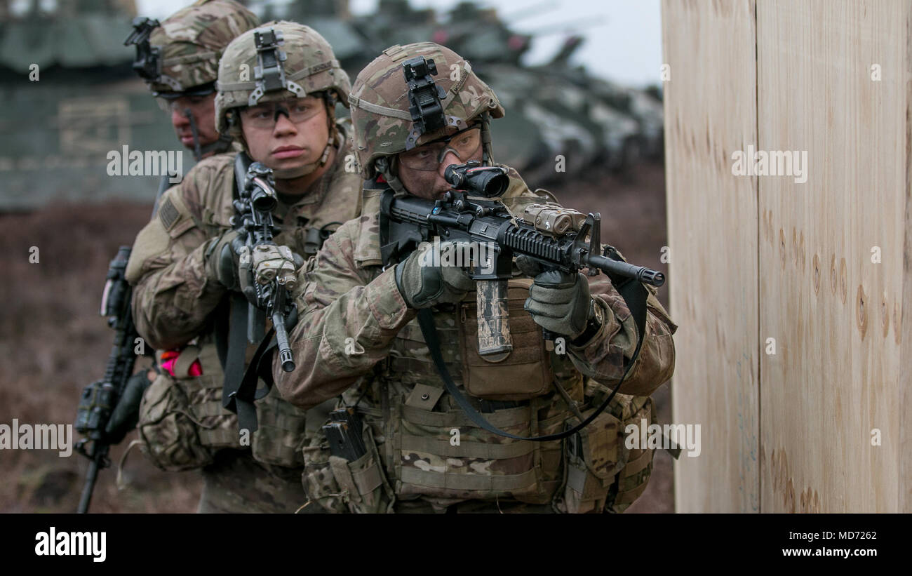 U.S. Army Cpl. Dolton McCullough, right, Pvt. Elias Gonzalez, middle ...