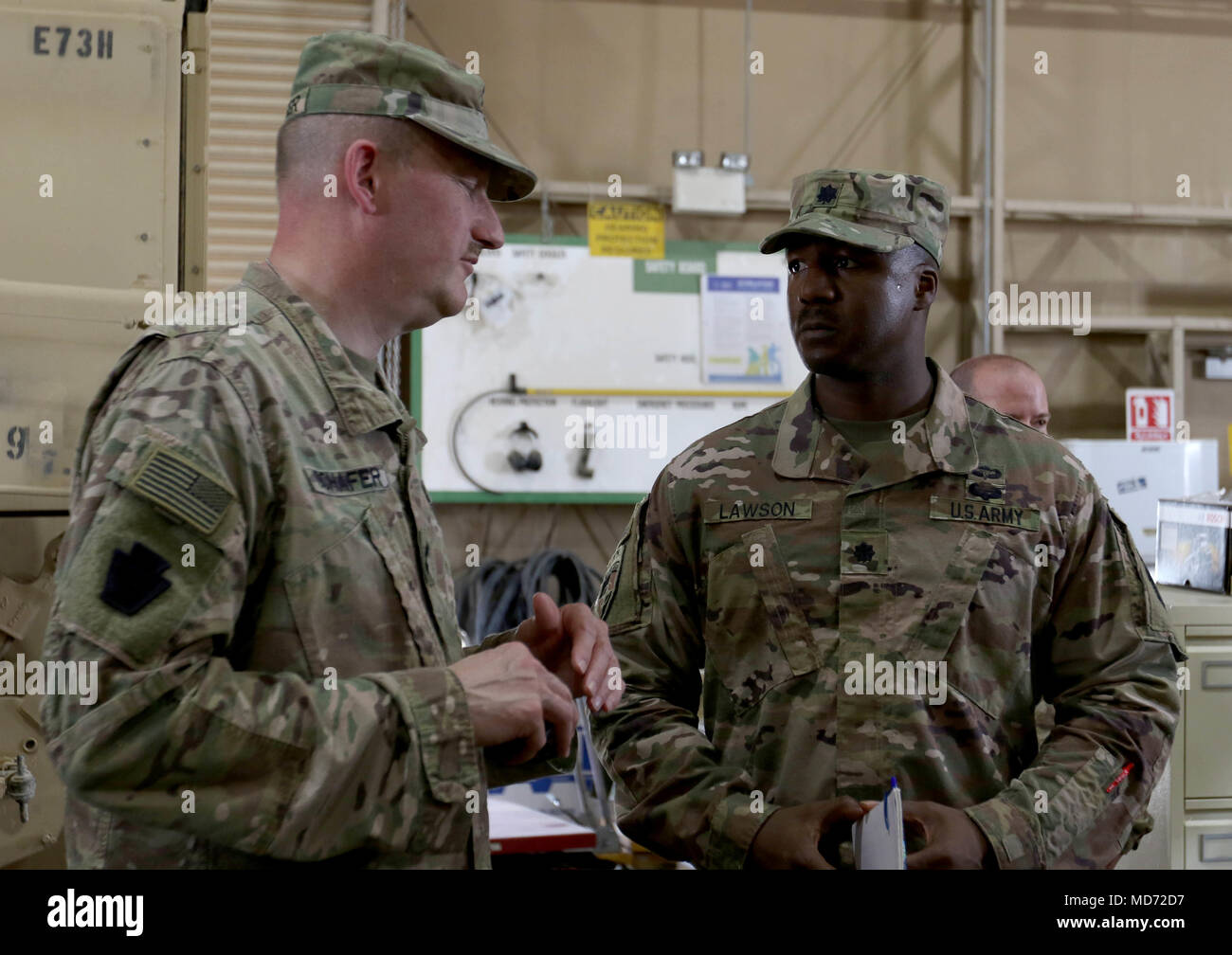 CAMP ARIFJAN, Kuwait – Maj. Gen. Andrew Schafer (left), commanding general of the 28th Infantry Division and Task Force Spartan, talks with Lt. Col. Ayo Lawson, commander of the 1st Battalion, 62nd Air Defense Artillery (ADA) Regiment, 11th Air Defense Artillery Brigade, TF Spartan, during a visit to the ADA location on March 21, 2018.  Lawson stressed his leadership ideals during Schafer’s time there. “I’m big on teamwork,” Lawson said.  “The key that we want at the end of the day is tactical and technical excellence.” (U.S. Army Photo by Staff Sgt. Matthew Keeler) Stock Photo