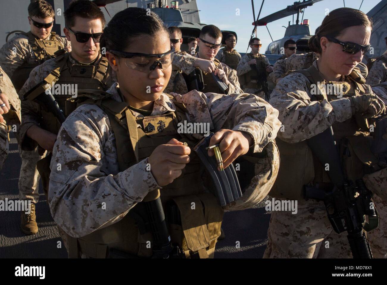 MEDITERRANEAN SEA (March 30, 2018) Marine Corps Sgt. Daneth Cueto, an embark specialist assigned to Combat Logistics Battalion 26, 26th Marine Expeditionary Unit (MEU) loads 5.56mm ammunition into a magazine during a deck shoot aboard San Antonio-class amphibious transport dock USS New York (LPD 21) March 30, 2018. The MEU maintains a constant state of readiness by doing routine weapons familiarization and deck shoots while deployed to U.S. 6th Fleet area of operations. U.S. 6th Fleet, headquartered in Naples, Italy, conducts the full spectrum of joint and naval operations, often in concert wi Stock Photo