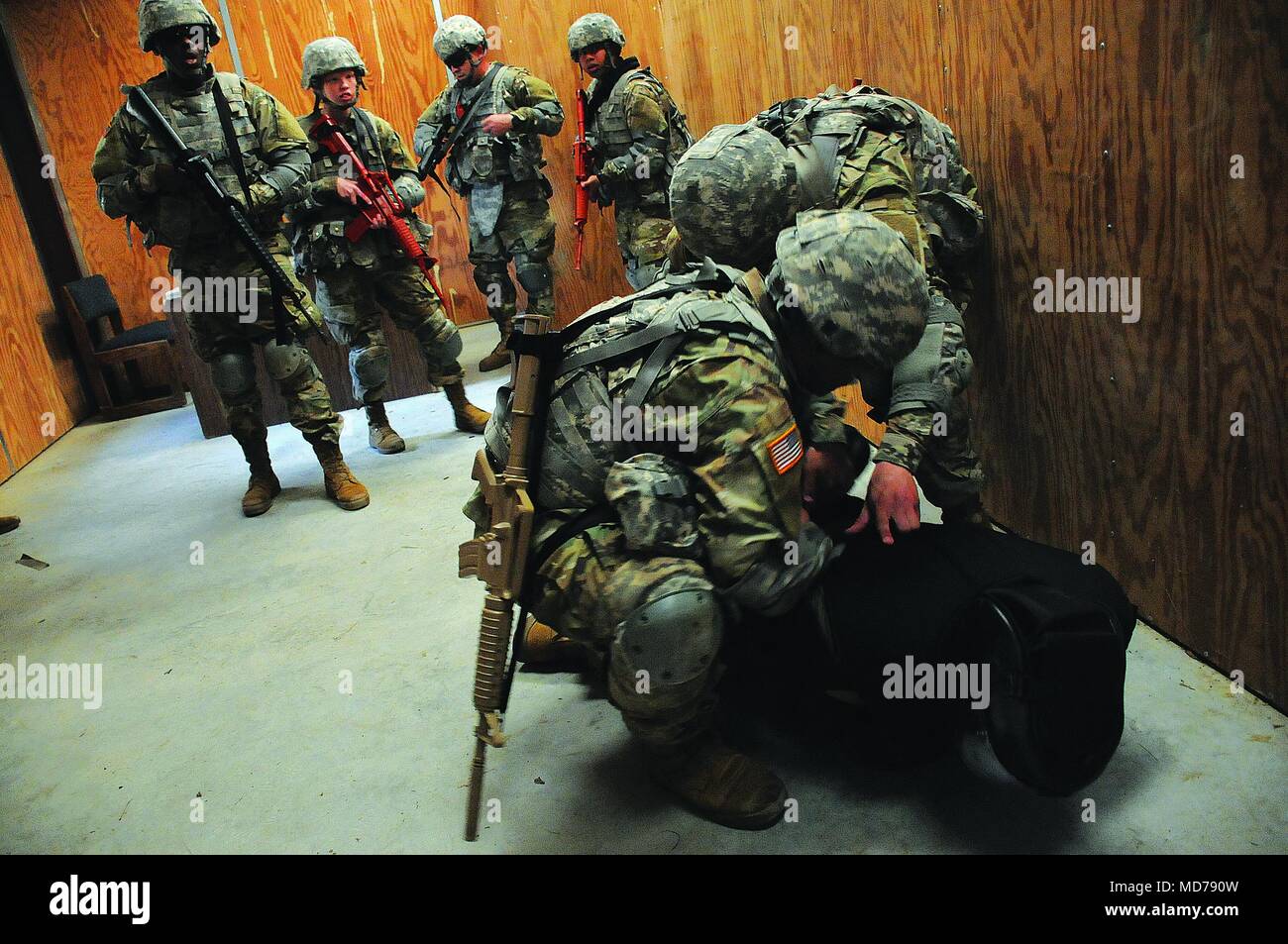 Team members handcuff the assailant Stock Photo Alamy