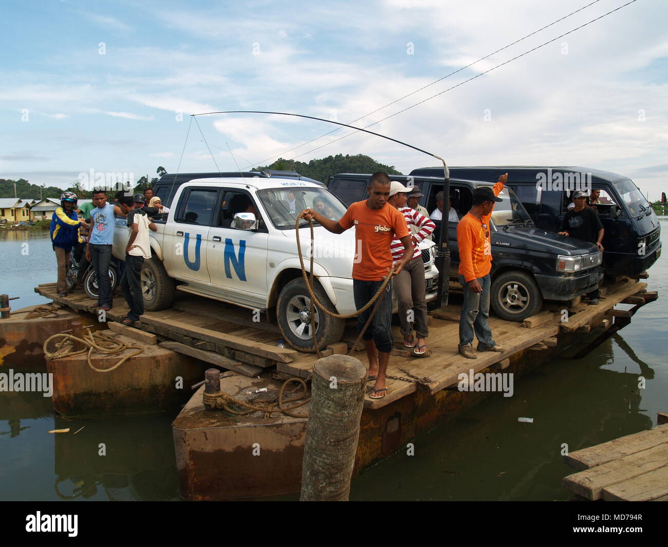 United Nations Vehicle loaded on a raft to crossing over the water bay ...