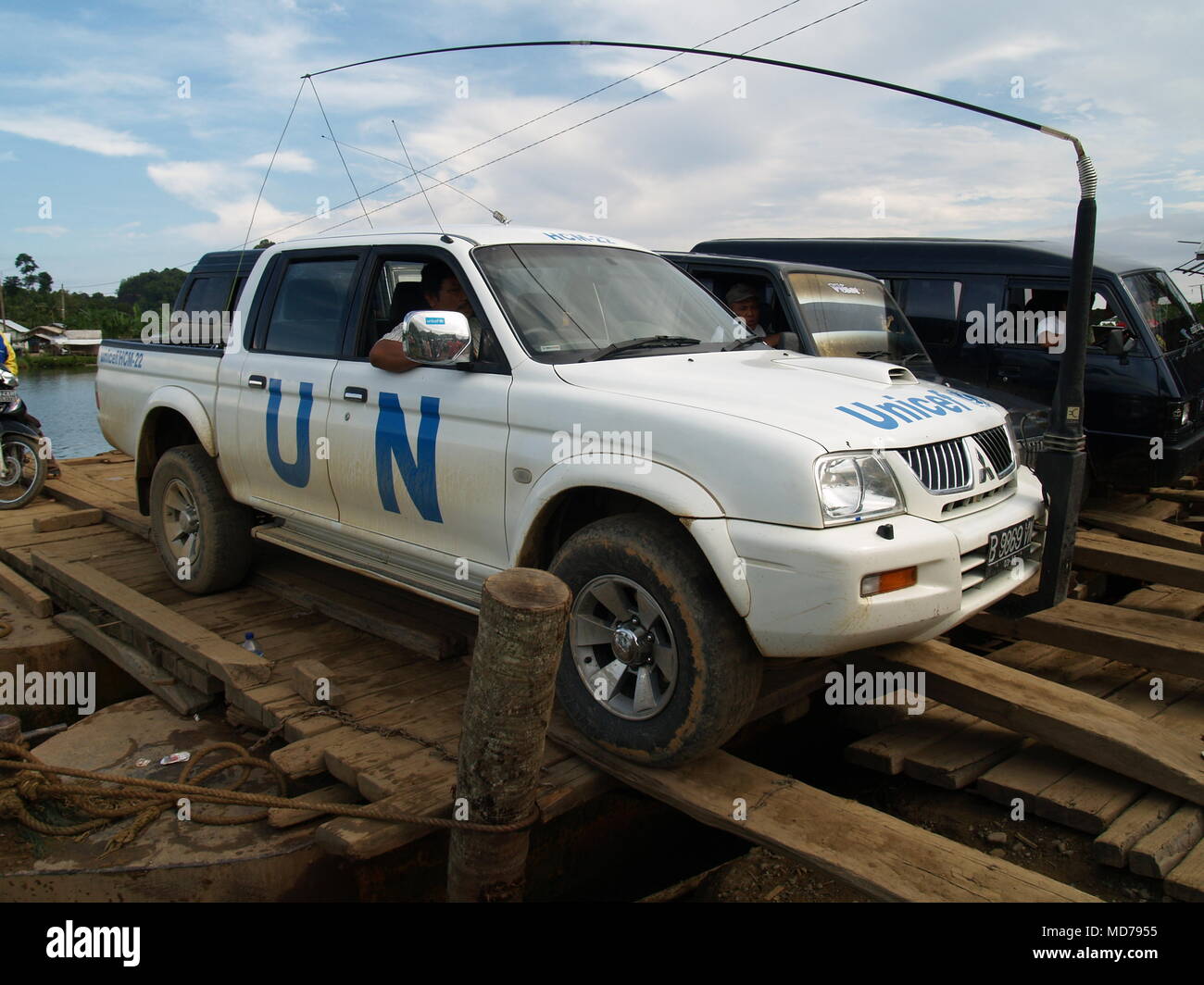 United Nations Vehicle loaded on a raft to crossing over the water bay ...