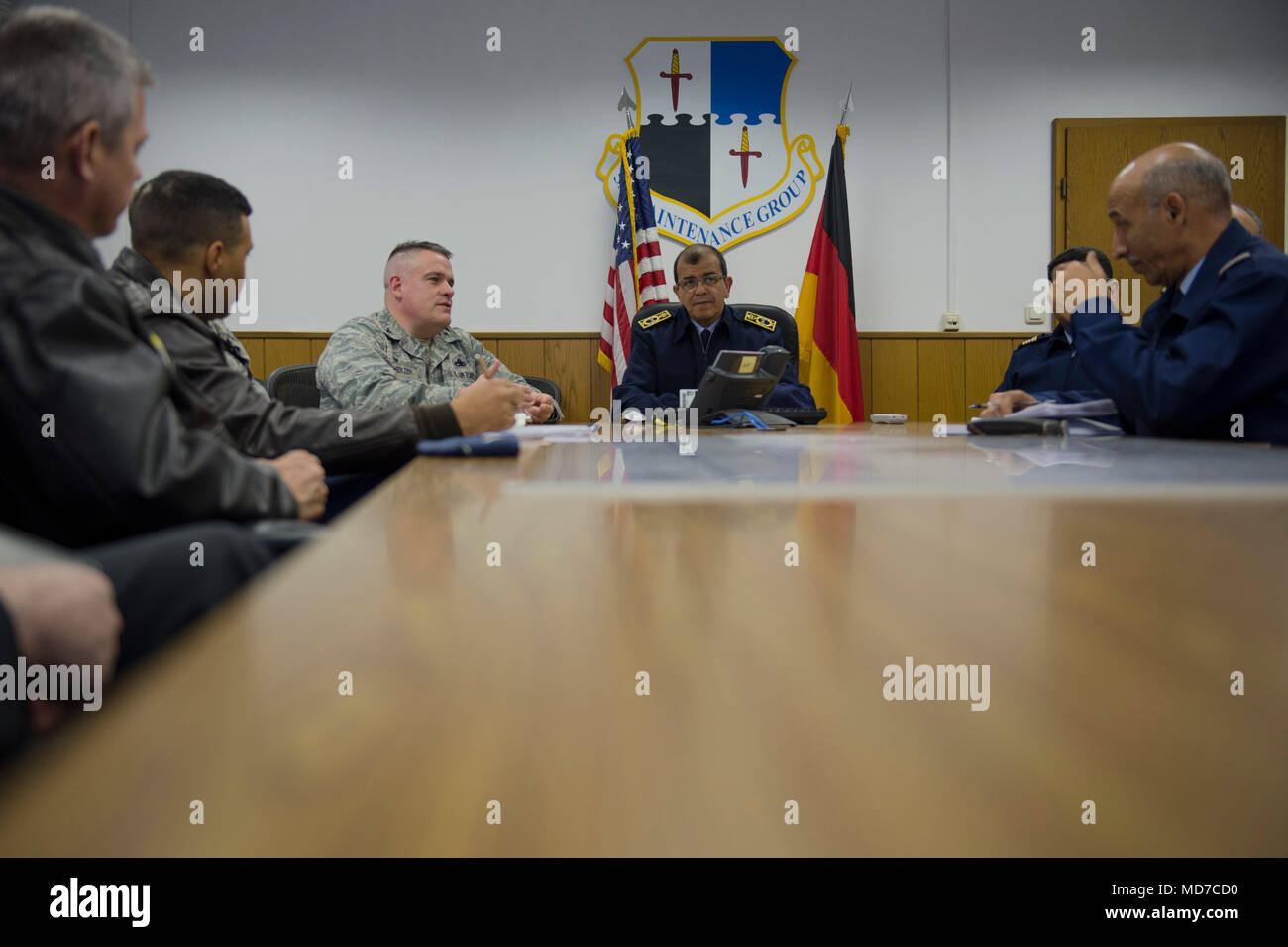 U.S. Air Force Col. Stephen Scherzer, 52nd Maintenance Group commander, briefs Maj. Gen. Hassan Fakri, Royal Moroccan Air Force deputy inspector, about the various planning and scheduling processes of the 52nd MXG at Spangdahlem Air Base, Germany, March 28, 2018. During the visit, senior leaders from the RMAF learned best practices from the MXG in order to better facilitate and operate their F-16 flying mission. (U.S. Air Force photo by Senior Airman Dawn M. Weber) Stock Photo