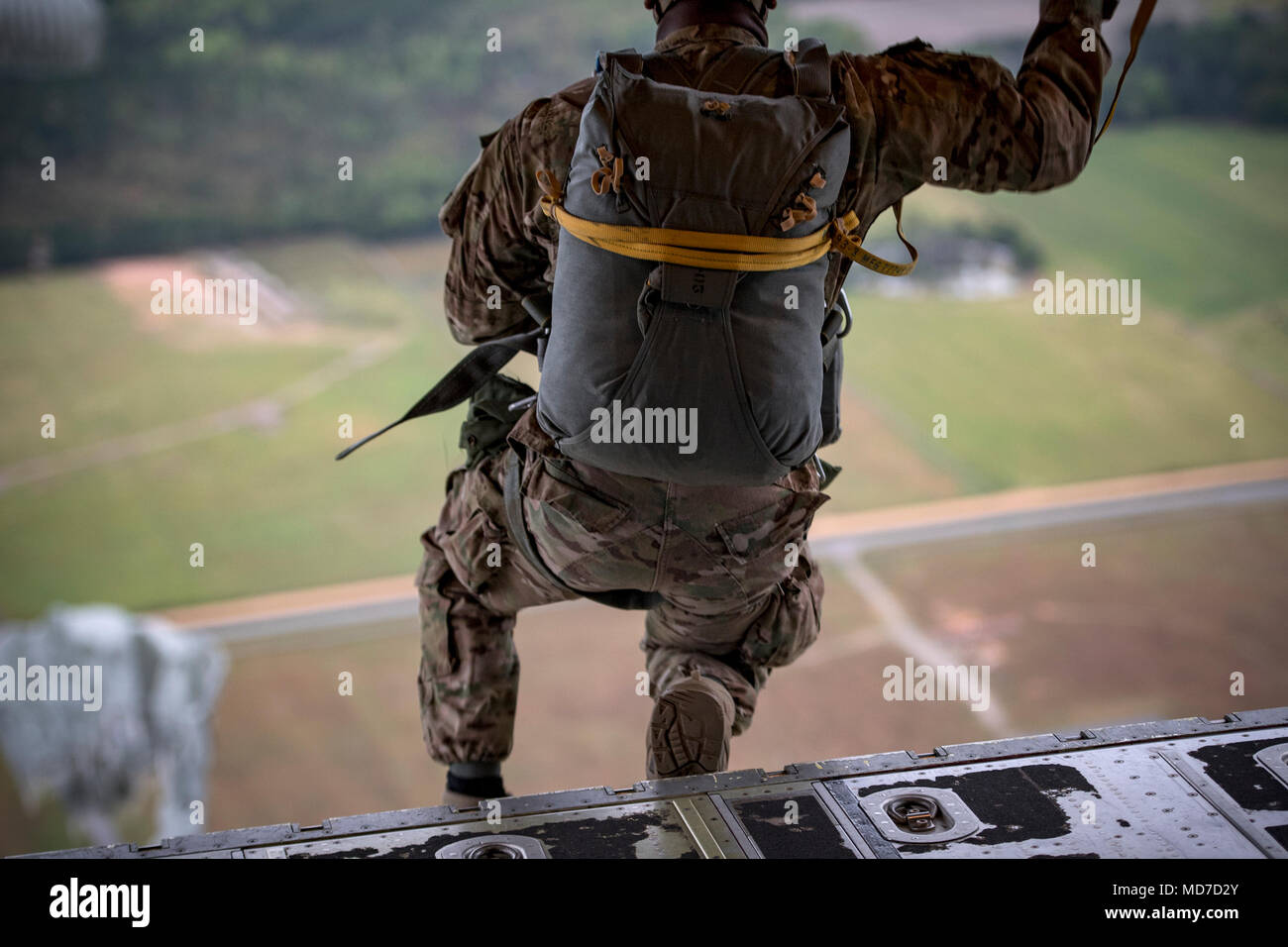 An Airman from the 820th Base Defense Group jump from an HC-130J Combat King II during static-line jump proficiency training, March 30, 2018, in the skies over Moody Air Force Base, Ga. The 820th BDG and the 71st RQS work together frequently so the defenders and the aircrew can maintain their qualifications. (U.S. Air Force photo by Staff Sgt. Ryan Callaghan) Stock Photo