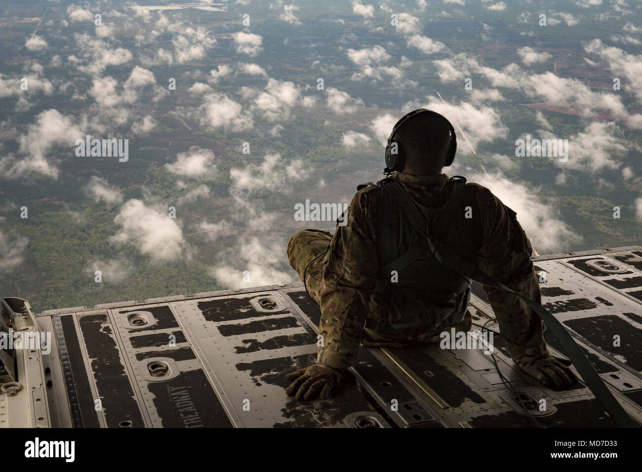 Staff Sgt. James Baker, 71st Rescue Squadron loadmaster, sits on the