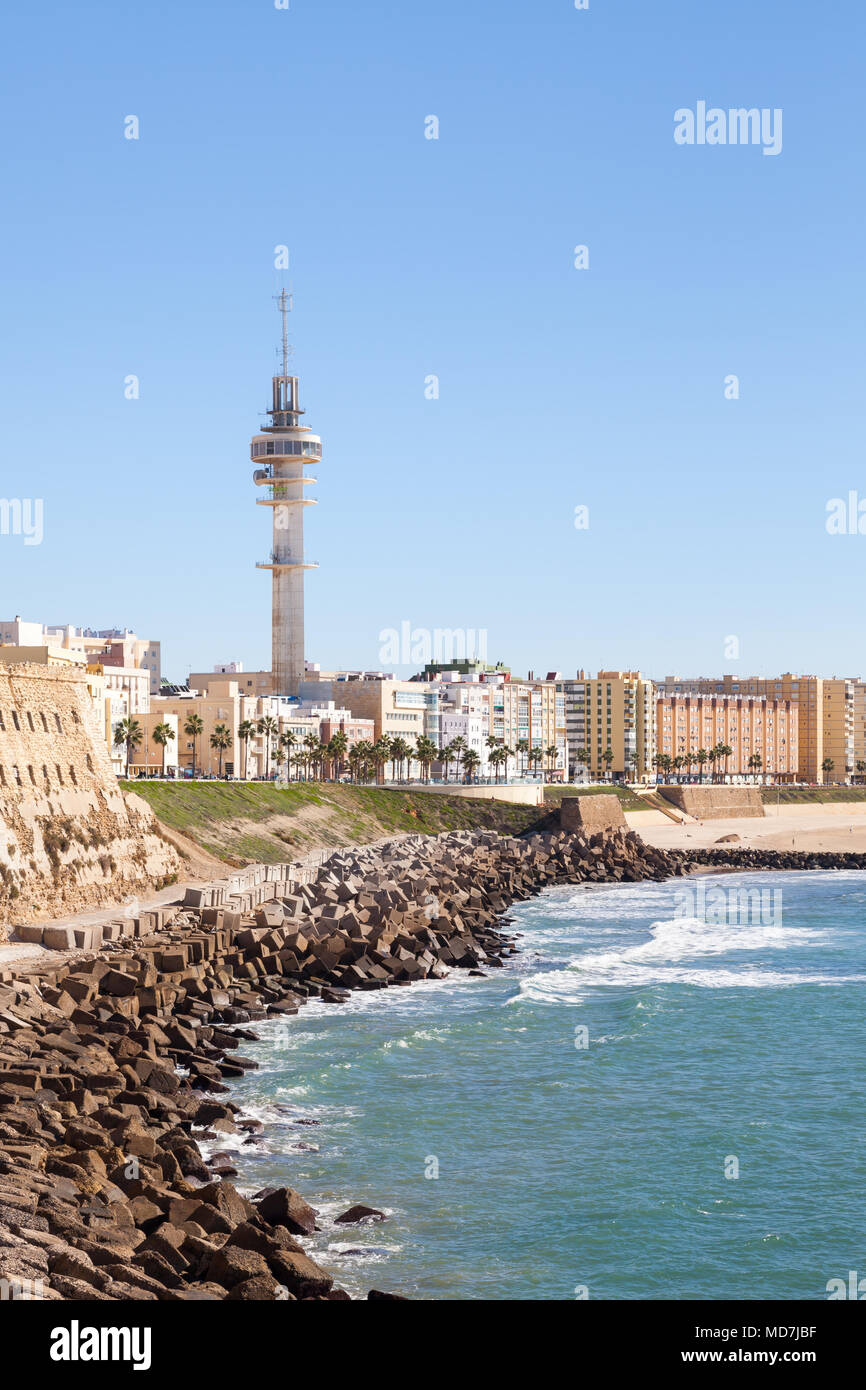 Cadiz waterfront in Spain and the view along the beach of Santa Maria del Mar. Stock Photo