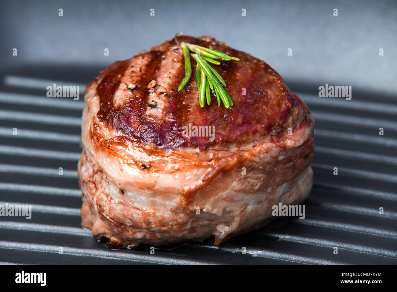 Fried beef steak on pan close-up view. Tasty fillet mignon steak. Stock Photo
