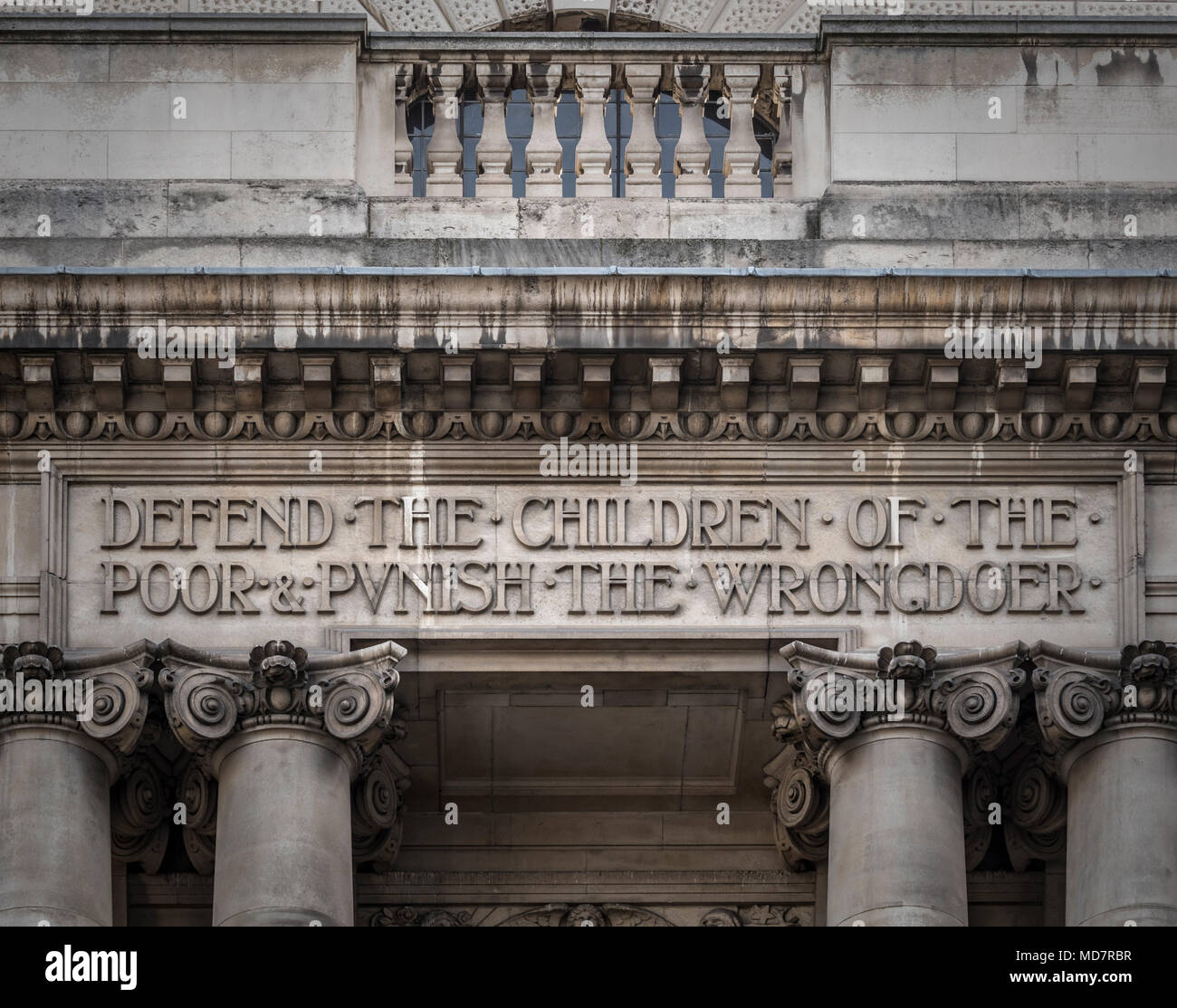 Inscription above the Entrance to Old Bailey London England UK 'Defend the Children of the Poor & Punish the Wrongdoer' Stock Photo