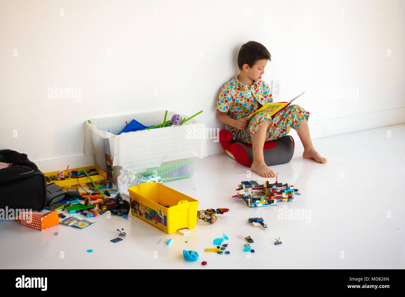 Little boy reading story books during play time Stock Photo