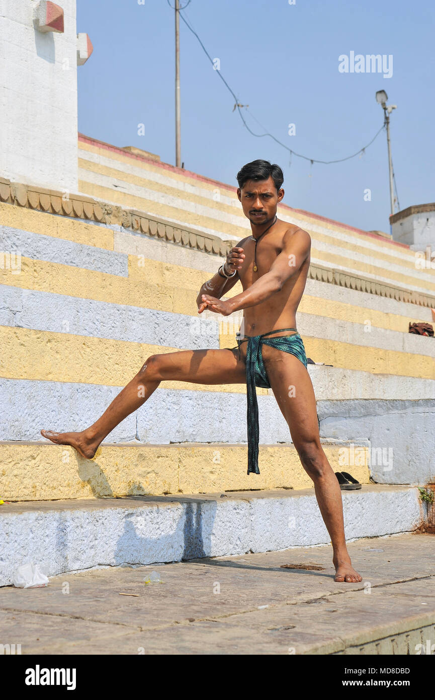 A poseur in a loincloth flexes his muscles for the camera Stock Photo