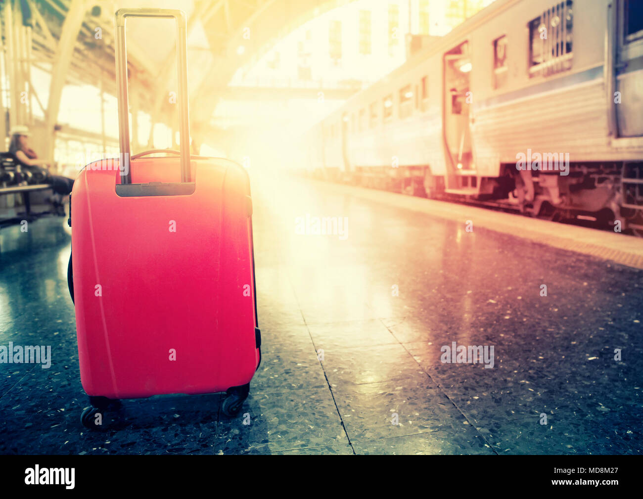 red traveling luggage in trains station Stock Photo Alamy