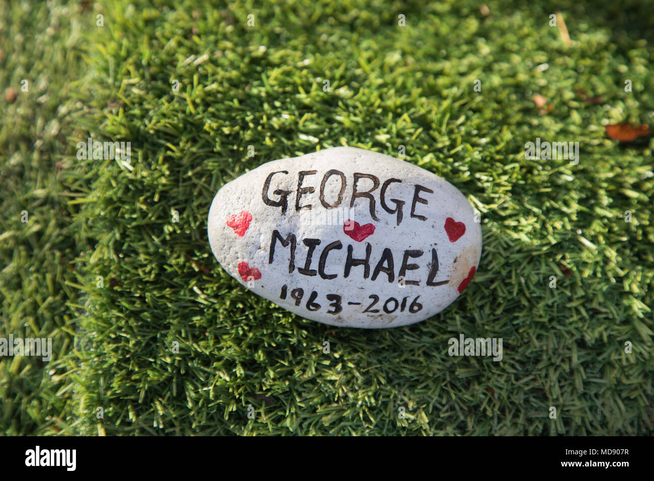 A pebble tribute left by a fan of pop star George Michael at a shrine or memorial to the late singer opposite his home in Highgate, north London Stock Photo