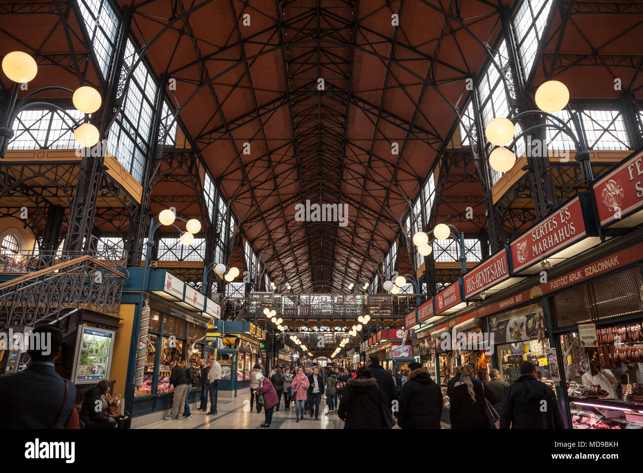 BUDAPEST, HUNGARY - APRIL 7, 2018: Interior of Budapest Great Market Hall (Nagy Vasarcsarnok) with a crowd in front. it is the biggest market hall of  Stock Photo
