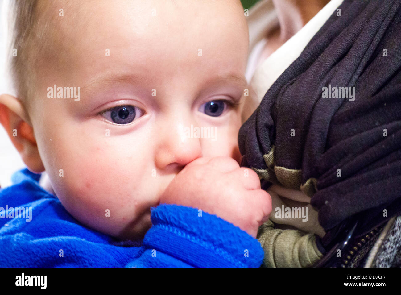 Close-up of baby boy thumb sucking, Greece Stock Photo