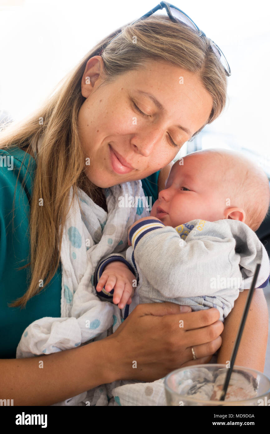 Mature woman holding her cute baby boy Stock Photo Alamy