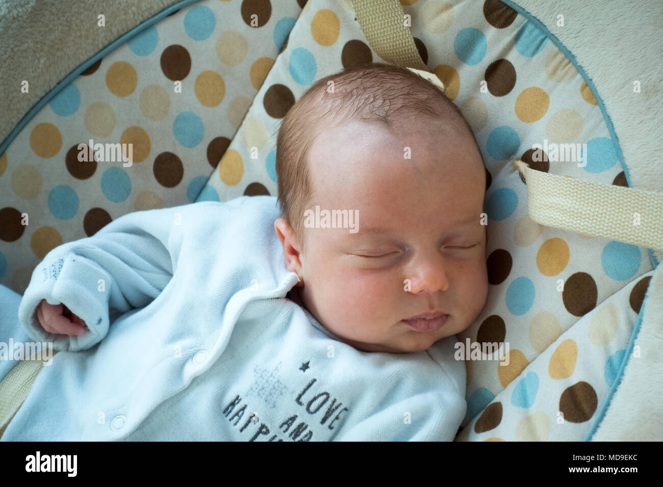 Cute newborn baby boy sleeping on bed Stock Photo Alamy