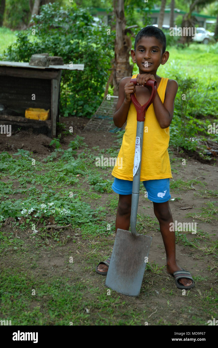 Kid with spade hi-res stock photography and images - Alamy