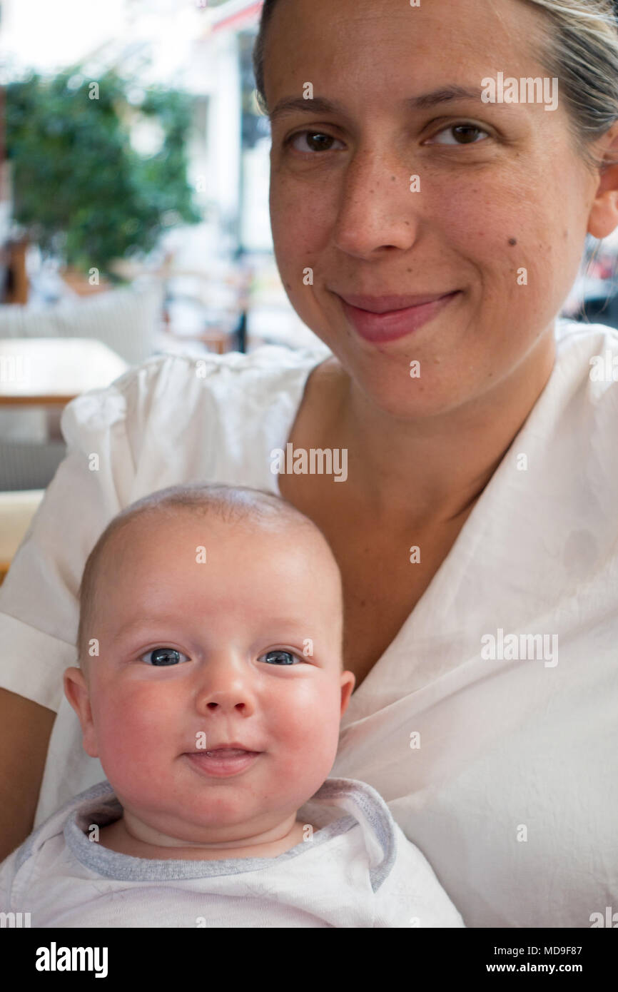 Mother with her little baby at restaurant, Heraklion, Greece Stock Photo
