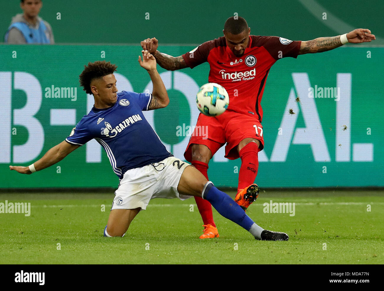 Gelsenkirchen. 18th Apr, 2018. Kevin-Prince Boateng (R) of Eintracht Frankfurt and Thilo Kehrer of Schalke 04 vie for the ball during the German DFB Pokal match between Schalke 04 and Eintracht Frankfurt at the Veltins Arena in Gelsenkirchen Germany, on April 18, 2018. Credit: Joachim Bywaletz/Xinhua/Alamy Live News Stock Photo