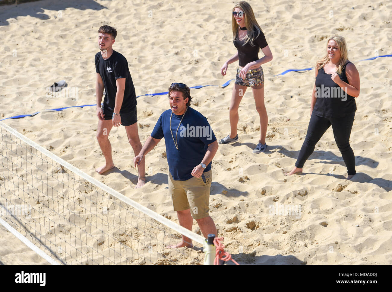 Brighton UK 19th April 2018  - James Argent known as Arg plays beach volleyball on Brighton seafront with extras from the reality television show 'The Only Way is Essex' as they enjoy the beautiful sunny weather during filming . The hot sunny weather is set to continue throughout Britain with temperatures expected to reach into the high twenties in parts of the South East Credit: Simon Dack/Alamy Live News Credit: Simon Dack/Alamy Live News Stock Photo