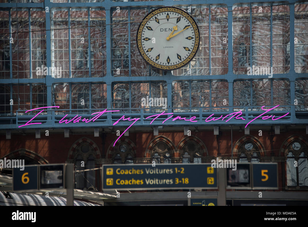 London, UK. 19th April 2018. The new neon artwork by Tracey Emin hangs over the international station at St Pancras - the message for lovers is 'I want my time with you'.Credit: Guy Bell/Alamy Live News Stock Photo