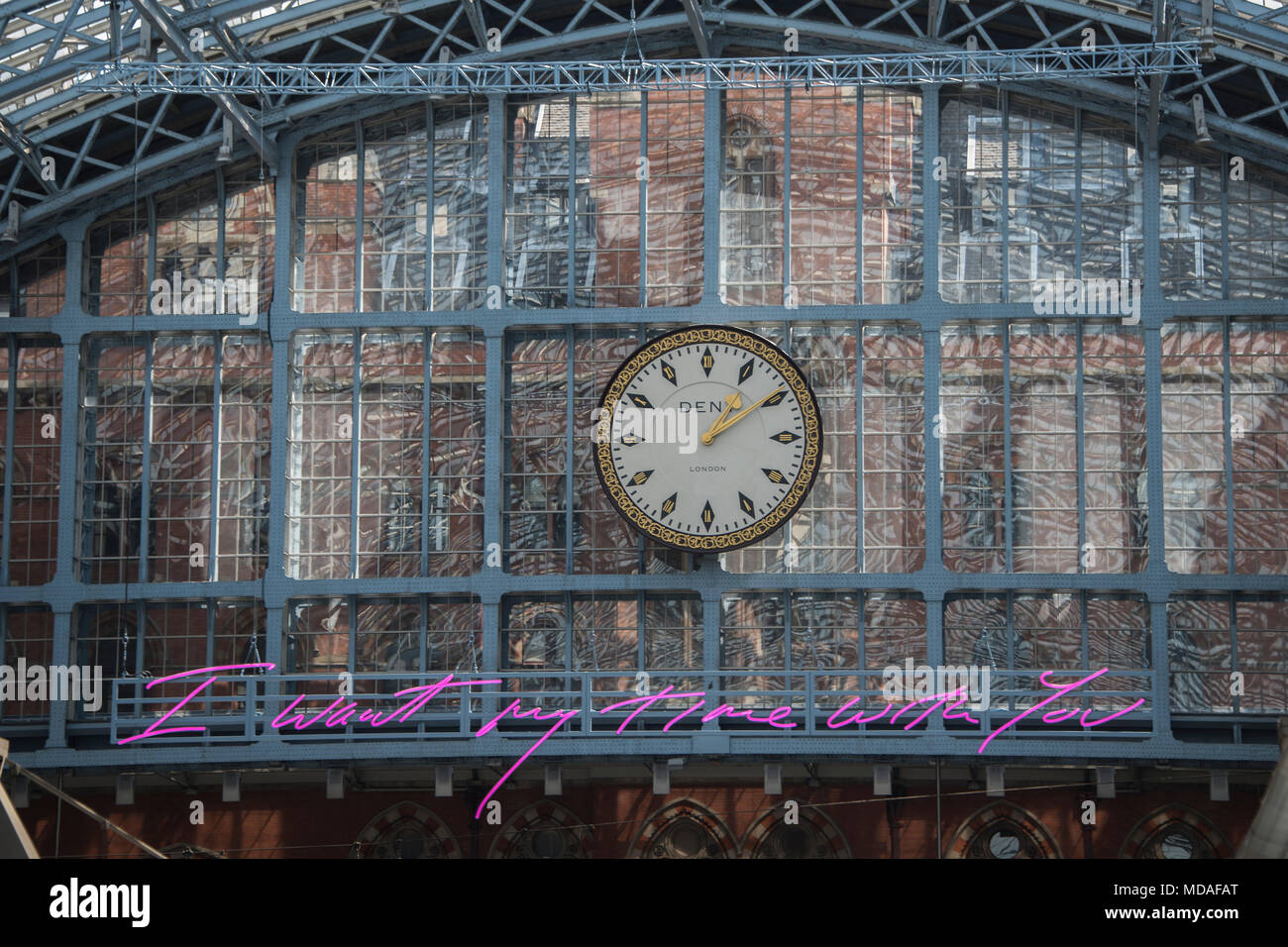 London, UK. 19th April 2018. The new neon artwork by Tracey Emin hangs over the international station at St Pancras - the message for lovers is 'I want my time with you'.Credit: Guy Bell/Alamy Live News Stock Photo