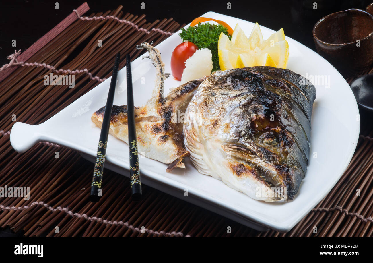 japanese cuisine. fried fish head on background Stock Photo - Alamy