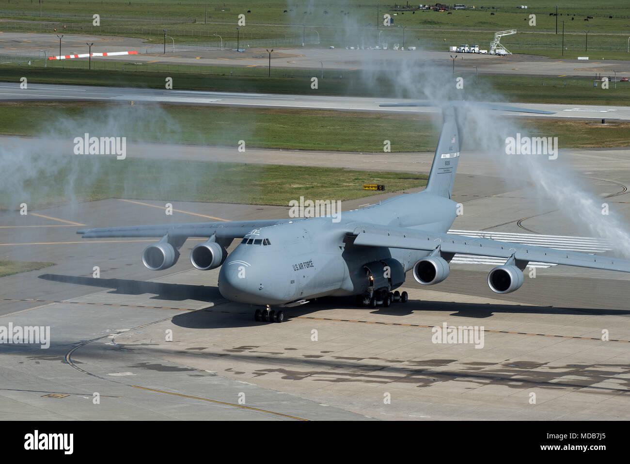The last C-5M Super Galaxy to join the fleet at Travis Air Force Base, Calif., arrives April 17, 2018. The C-5M, with a cargo load of 281,001 pounds, can fly 2,150 nautical miles, offload, and fly to a second base 500 nautical miles away from the original destination, all without aerial refueling. (U.S. Air Force photo by Louis Briscese) Stock Photo