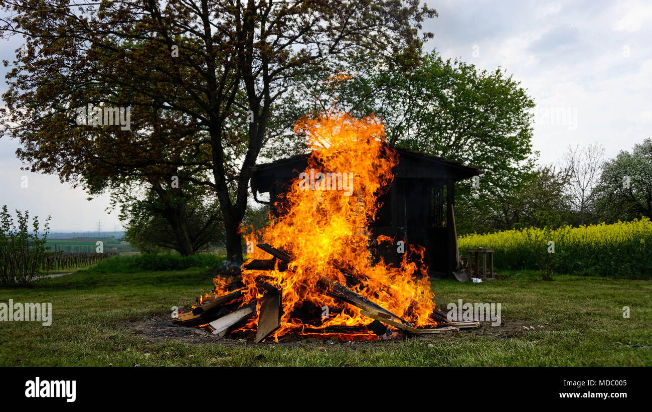 Bonfire in front of a shack Stock Photo