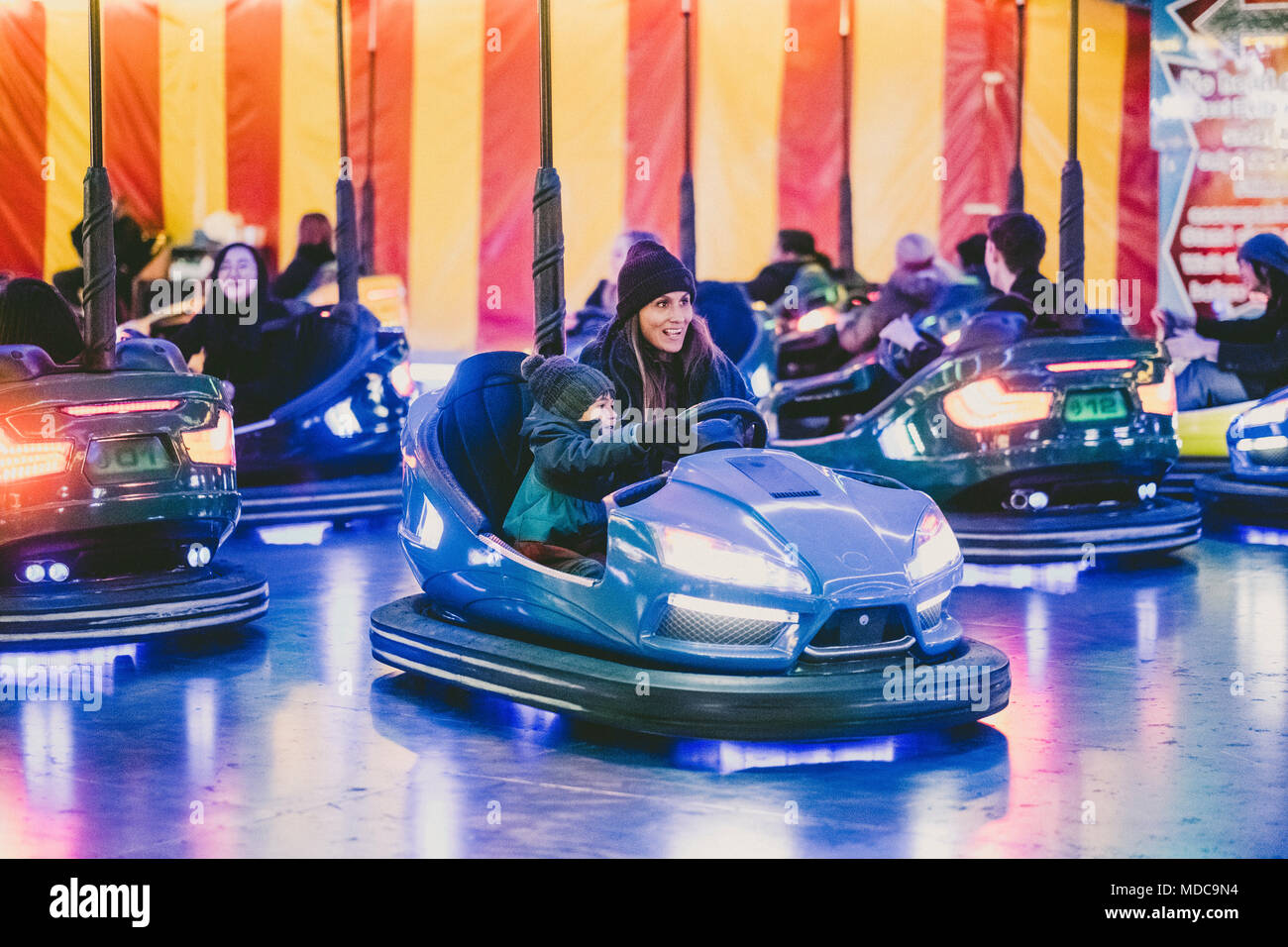 Mother and son driving bumper car, London, England, UK Stock Photo Alamy