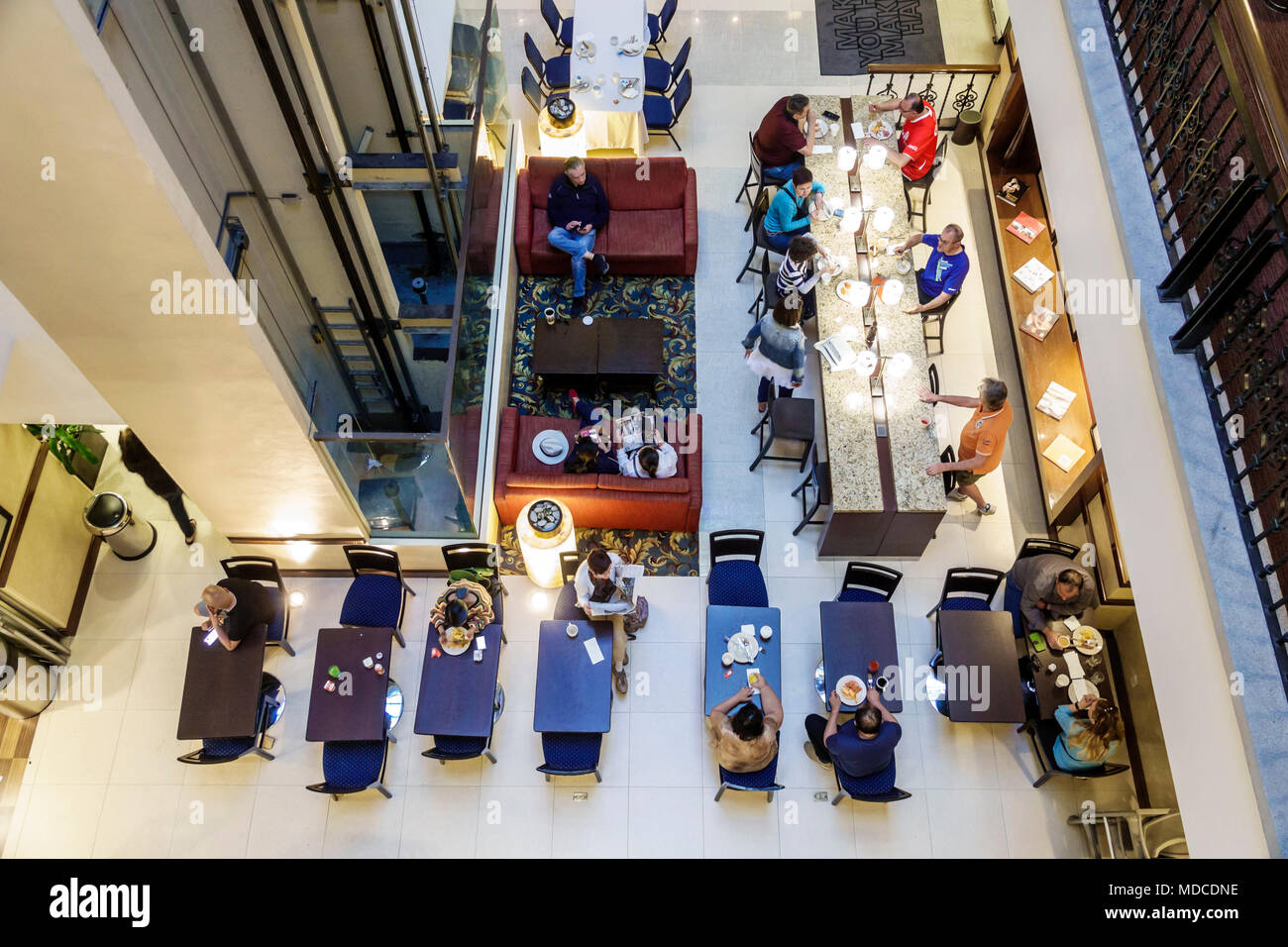 Mexico City,Mexican,Hispanic,historic Center Centre,5 de Febrero,Hampton Inn Centro historico,hotel,interior inside,lobby,overhead view,guest,tables M Stock Photo