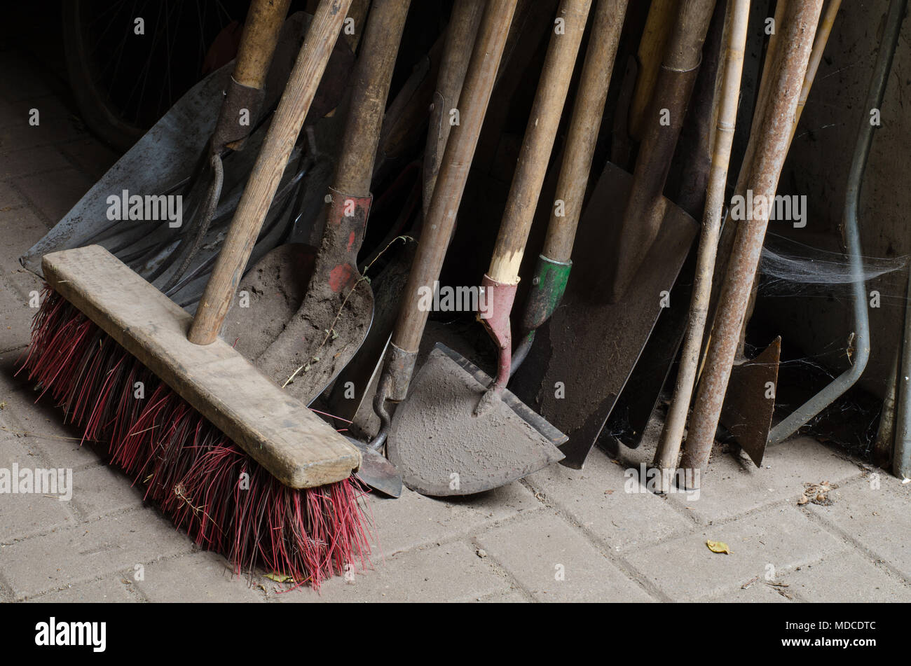 closeup of old dusty tools for agricultural and farming use including