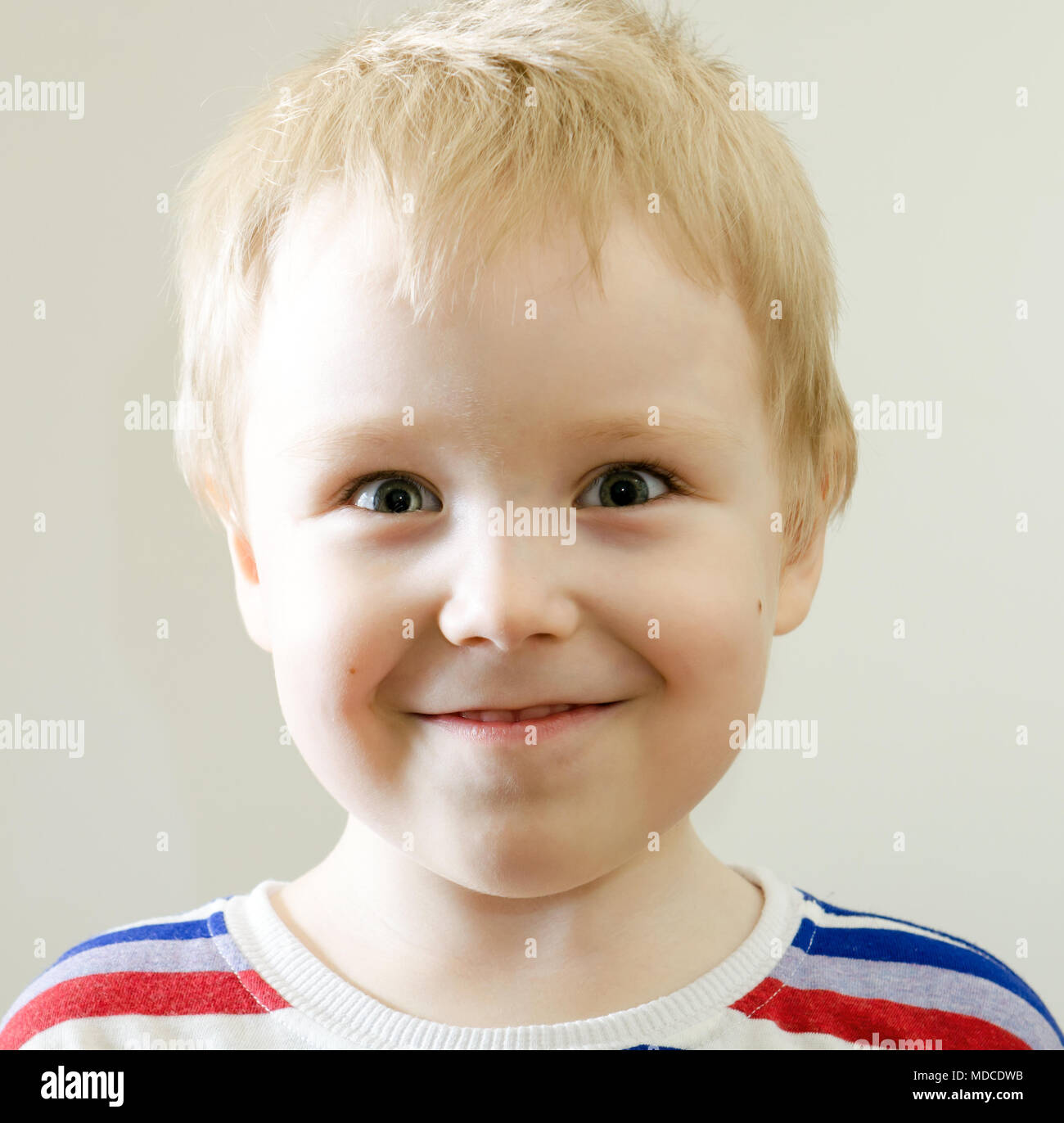 Happy young boy with smile on his face Stock Photo