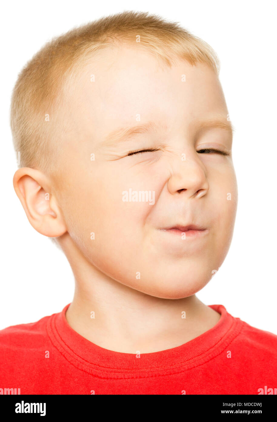 Four-Year-Old Boy making a Winking Face Stock Photo