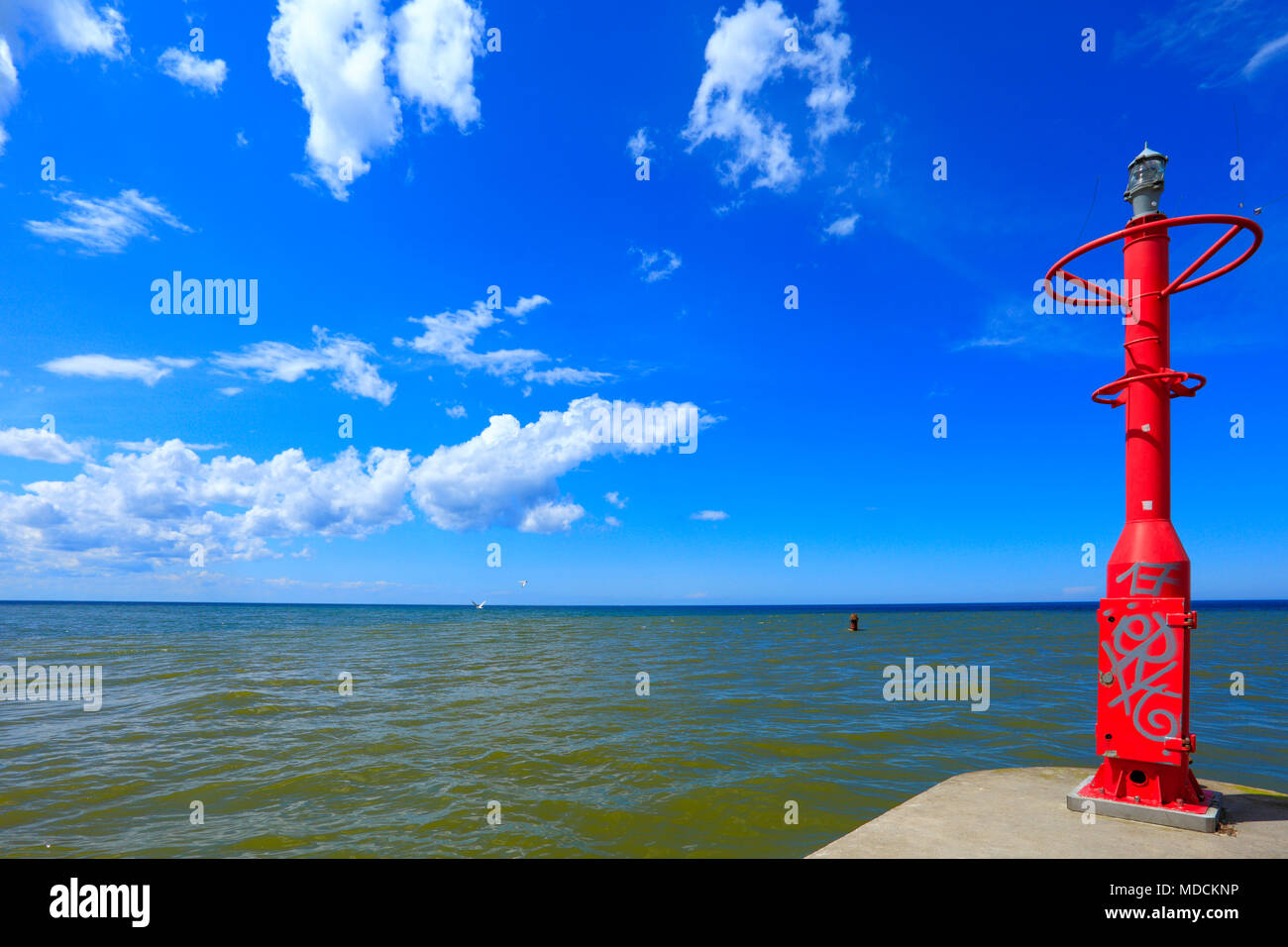 Rowy, Pomerania / Poland - 2009/07/02: Lighthouse tower at the Lupawa river mouth into Baltic sea Stock Photo