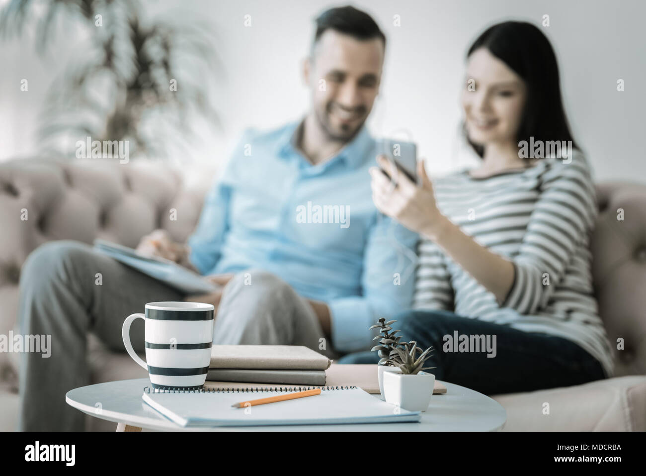 Happy two colleagues taking break Stock Photo